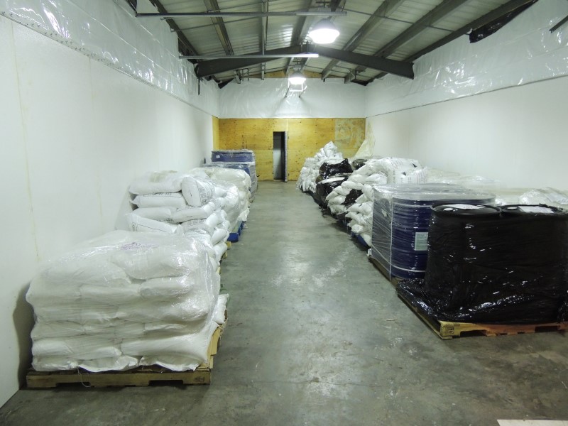 Pallets of bags and drums of chemicals located and seized during the execution of the search warrant.