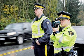 RCMP officers conducting a speed watch