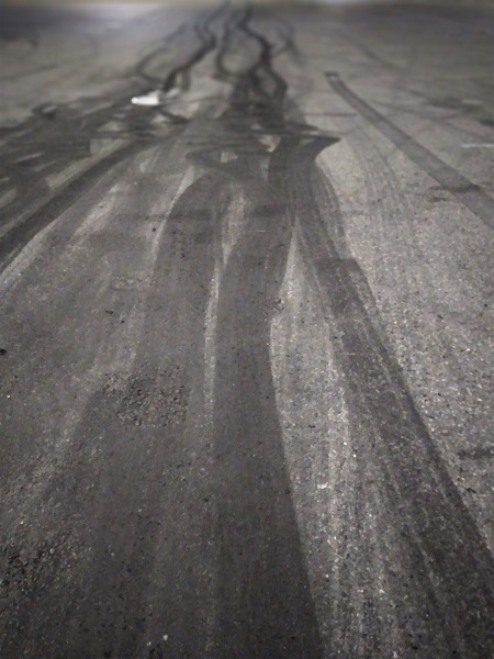 Photo of tire marks in parking lot