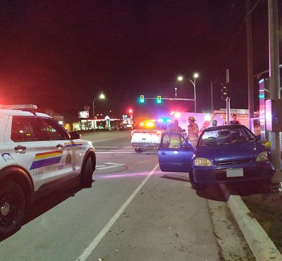 Photo of car the crashed into a street light pole