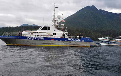 Inkster RCMP boat tugging a float plane