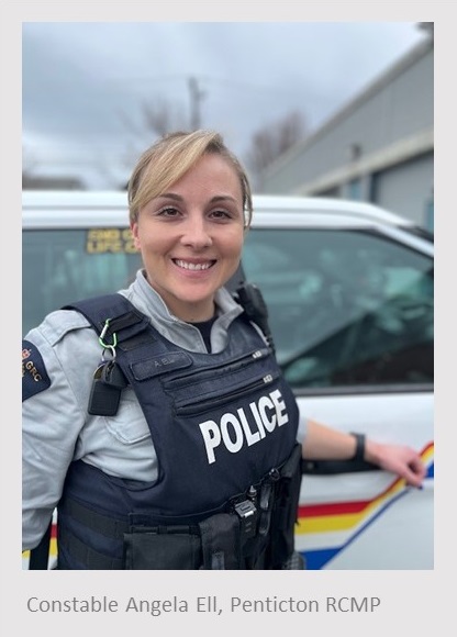 Caucasian female standing in front of a police vehicle wearing an RCMP uniform. Text under the photo reads, Constable Angela Ell, Penticton RCMP.